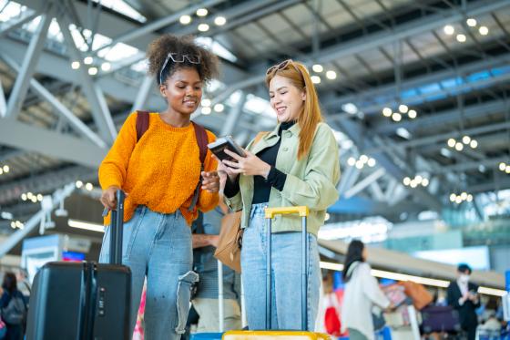 women with suitcases at the airport