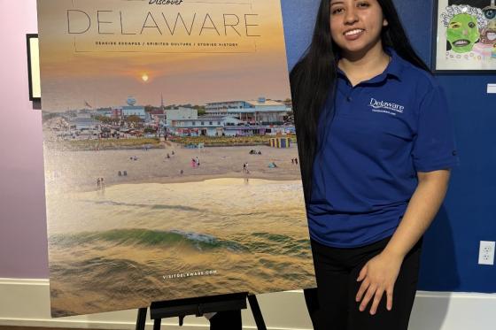 Kimberly Berduo Velasquez with Delaware sign