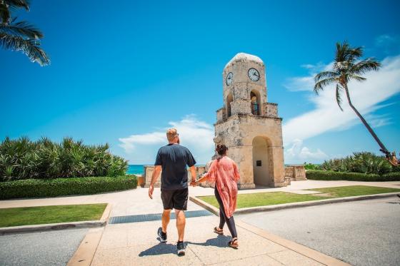 Palm Beach visitors walking across the road