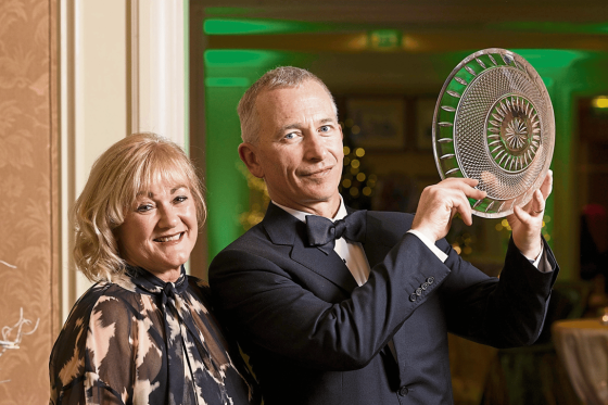 Award winners holding award