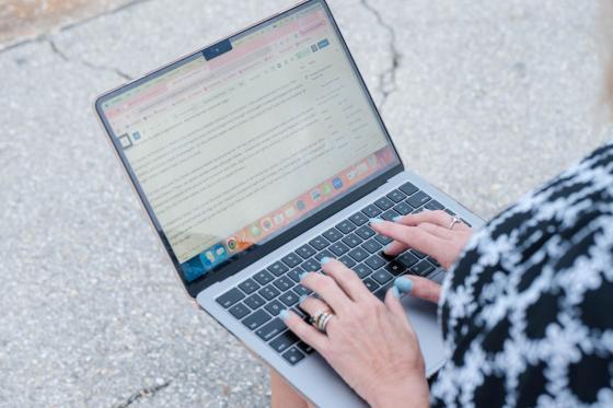 woman typing on laptop