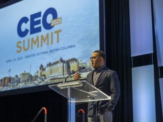 Al Hutchinson speaking on stage at the 2023 CEO Summit