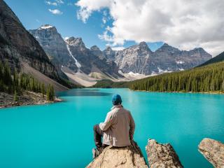 Hiker at Moraine Lake during summer in Banff National Park, Alberta, Canada.