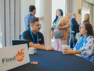 a partner speaking to a member during annual convention