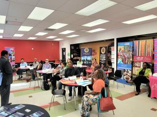 Greater Miami CVB team sitting in a classroom while a speaker presents