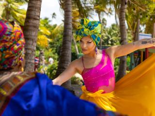 performer dancing in brightly colored clothing