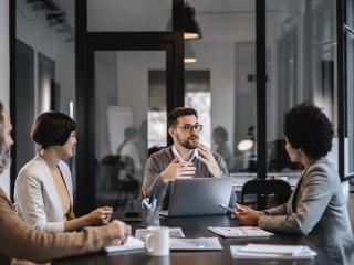 man leads presentation to his colleagues