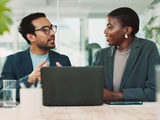 team members have a conversation in the office