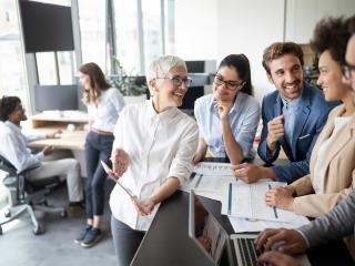 group of coworkers smiling and chatting