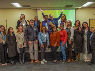 Social Impact Committee pose for a photo at their committee meeting in Spokane