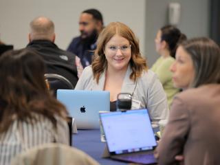 CDME student talking to classmates