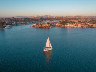 sailboat in the harbor in Newport Beach, CA