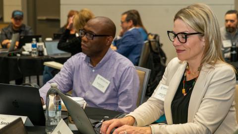 CDME candidates working at laptops at 2023 CDME courses in Dallas, TX