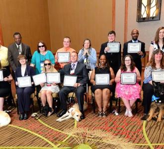 ACB group photo with certificates and dogs