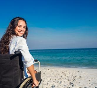 woman in a wheelchair on the beach