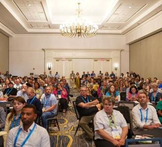 room of attendees at Annual Convention listening to the speaker
