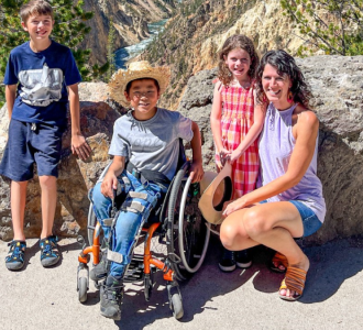 family posing for a photo on a hike