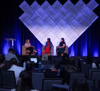 marketing and communications summit panelists on stage
