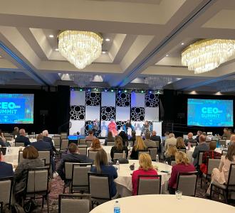 panelists on stage at CEO Summit