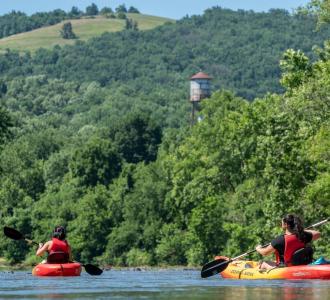 two people kayaking on the river