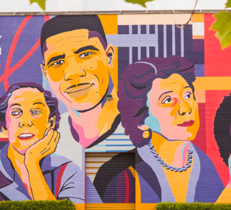 Icons Mural in Jackson, MS that includes colorful depictions of the city's notable citizens