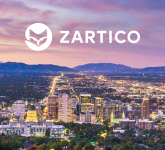 Zartico logo over colorful image of city in the distance