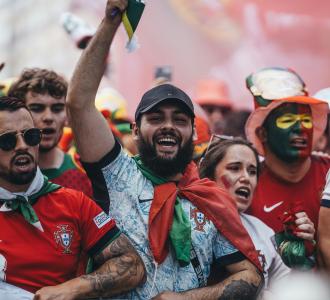soccer fans cheering in the crowd