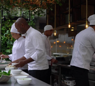 chefs working together to prepare a meal