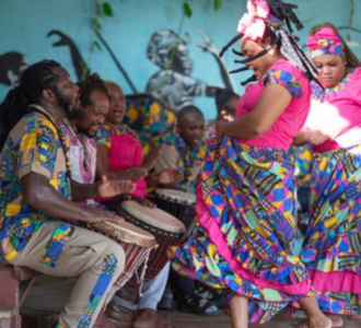 People in bright clothing dancing