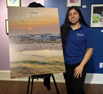Kimberly Berduo Velasquez with Delaware sign