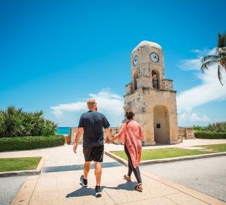 Palm Beach visitors walking across the road