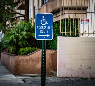 A blue sign indicating an accessible route